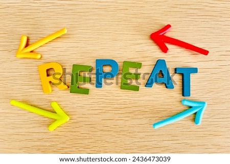 repeat text and cyclic arrows Royalty-Free Stock Photo #2436473039