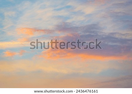 Prepare to be inspired by nature's extraordinary masterpiece, where the sky meets the earth in a breathtaking pastel-colored spectacle at sunrise! Skyline Serenade Cloudy Canvas Royalty-Free Stock Photo #2436476161