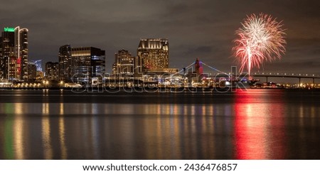 Night photo of downtown skyline and fireworks on San Diego Bay in San Diego, California, USA taken on March 4, 2024.