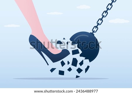 Woman foot in high heels breaks wrecking ball. Overcoming obstacles, feminine power. Human rights, gender equality. Success in career and business. Freeing yourself from shackles and stereotypes. Royalty-Free Stock Photo #2436488977