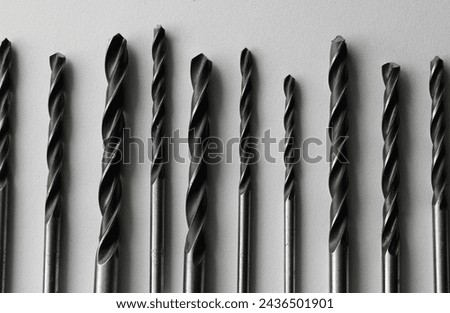 Steel Bits For Drill Driver Laid Out In Order On White. Stock Photo Of Carpenters Equipment 
