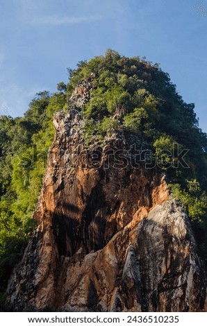 Limestone mountain seen Kin Loong Valley, Ipoh, Perak, Malaysia. Royalty-Free Stock Photo #2436510235