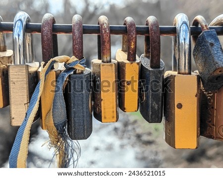 Locked hearts, concept. Rusty padlocks on a metal fence. A symbol of eternal love.