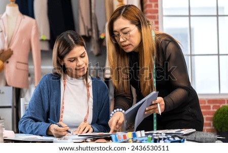 Collaboration and creativity in fashion design of teamwork, two diverse and talented designer collaborating on fabric swatches and design choices, creative studio, textile industry, fabric selection