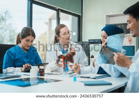 A diverse group of healthcare professionals, including doctors, nurses, and specialists, engaging in a collaborative meeting to discuss medical cases and share expertise in a hospital