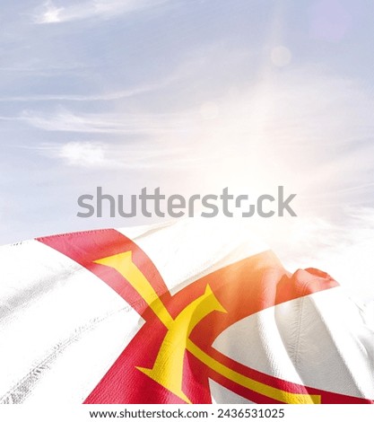 Guernsey waving flag in beautiful sunlight.