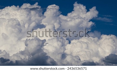 Close view of some cumulus clouds, during stormy weather Royalty-Free Stock Photo #2436536571