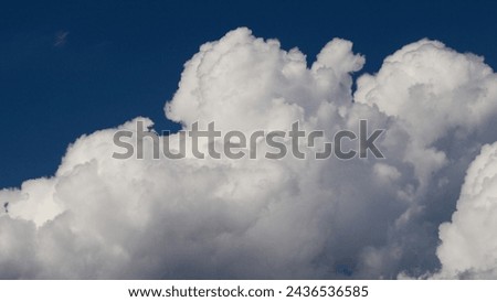Close view of some cumulus clouds, during stormy weather Royalty-Free Stock Photo #2436536585
