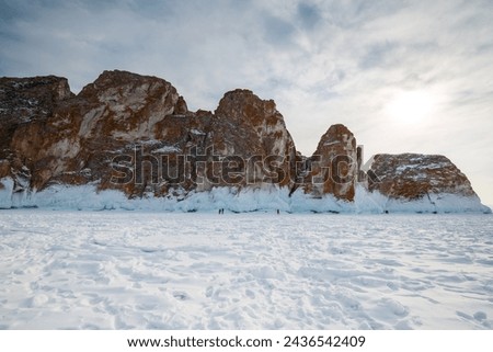 Coast of lake Baikal in winter, the deepest and largest freshwater lake by volume in the world, located in southern Siberia, Russia Royalty-Free Stock Photo #2436542409