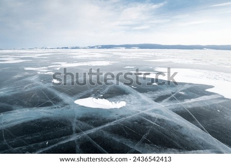 Lake Baikal in winter, the deepest and largest freshwater lake by volume in the world, located in southern Siberia, Russia Royalty-Free Stock Photo #2436542413