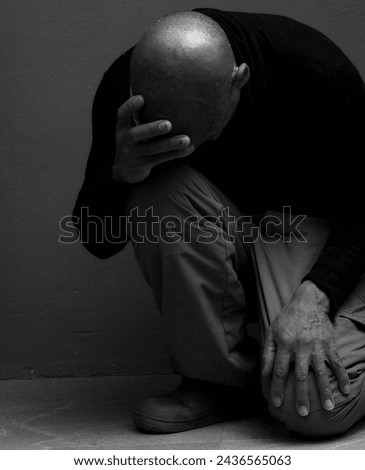 black man praying to god with hands together Caribbean man praying on black background with people stock photos stock photo