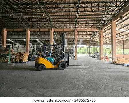 A warehouse full of rubber sheets ready to be sent for production. A raw rubber latex flat to dry. Rubber sheet is a raw material for many industrial product. Royalty-Free Stock Photo #2436572733