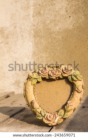 Picture frame is placed on a wooden
