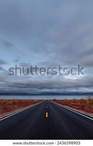  Spectacular Sunset: 4K Ultra HD Image of Desert Road to Lakeshore with Clouds at Sunset Royalty-Free Stock Photo #2436598903