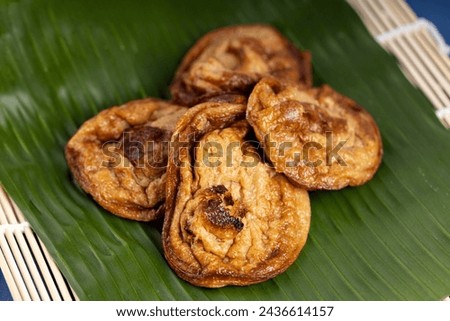 "Akok" refers to a traditional Malaysian dessert. It's a type of coconut pancake, often prepared in small, cupcake-like molds. The picture was taken in March 2024.