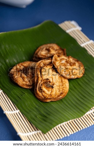 "Akok" refers to a traditional Malaysian dessert. It's a type of coconut pancake, often prepared in small, cupcake-like molds. The picture was taken in March 2024.