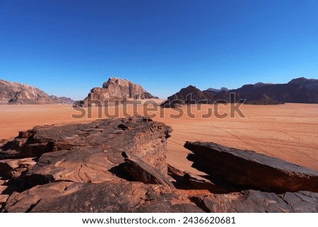 Beautifull picture jf Wadi Rum desert with red sands and brown rocks for wallpaper