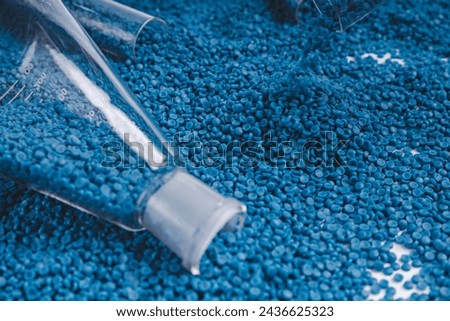 White plastic grain, plastic polymer granules,hand hold Polymer pellets, Raw materials for making water pipes, Plastics from petrochemicals and compound extrusion, resin from plant polyethylene. Royalty-Free Stock Photo #2436625323