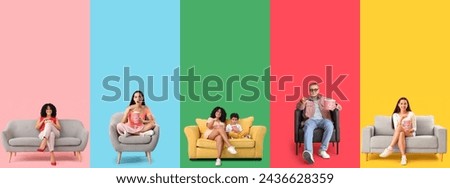 Group of people with popcorn watching movie on color background