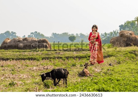 Indian rural girl smiling and enjoying nature. Freedom concept.