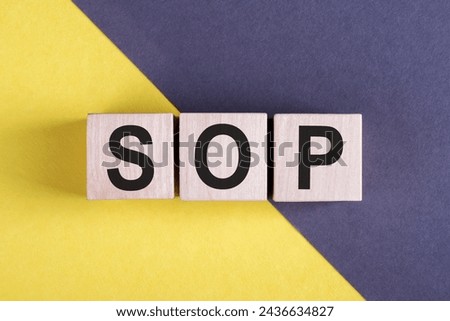 Wooden blocks with the word SOP - Standard operating procedure. Instructions to assist employees in complex routine operations. Business concept Royalty-Free Stock Photo #2436634827