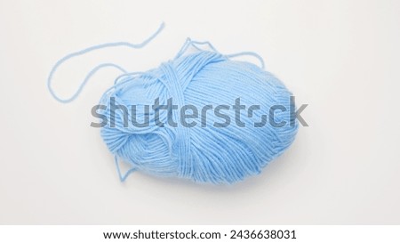 Color yarn for knitting, white background. Top view. Copy space, flat lay Royalty-Free Stock Photo #2436638031