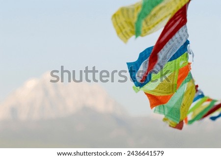 Prayer flags blowing in wind, snow mountain, tagong, sichuan, china, asia Royalty-Free Stock Photo #2436641579