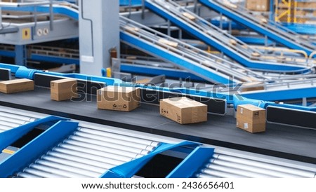 Recyclable Cardboard Box Being Transported on a Conveyor Belt in a Modern Logistics Center. Parcel is Prepared for Delivery to an Online Client. Rendered Conveyor System of a Big Retail Business Royalty-Free Stock Photo #2436656401