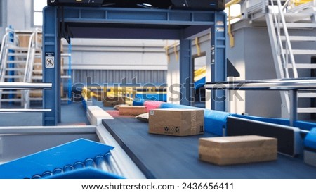 Recyclable Cardboard Box Being Transported on a Conveyor Belt in a Modern Logistics Center. Parcel is Prepared for Delivery to an Online Client. Rendered Conveyor System of a Big Retail Business Royalty-Free Stock Photo #2436656411