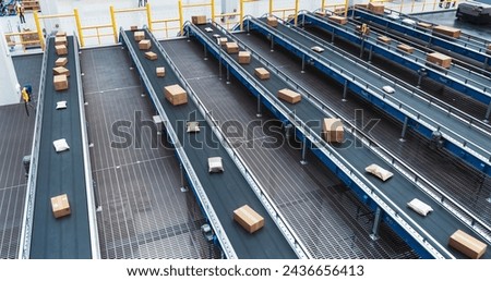 High Angle with Parcels, Boxes and Packages Moving on a Conveyor Line in a Modern Logistics Center with Autonomous Sorting Technology. Online Shopping Orders Efficiently Prepared for Delivery