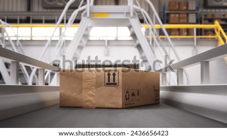 Recyclable Cardboard Box Being Transported on a Conveyor Belt in a Modern Logistics Center. Parcel is Prepared for Delivery to an Online Client. Conveyor System of a Big Retail Business Royalty-Free Stock Photo #2436656423