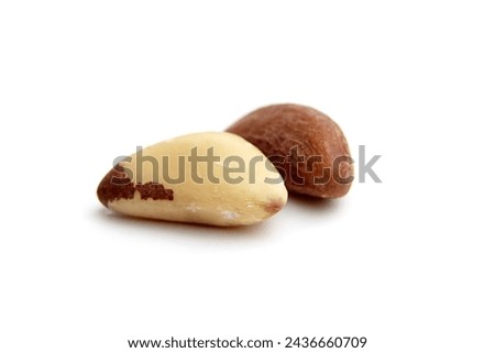 Two Brazil nuts isolated on a white background closeup