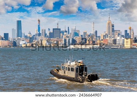 A New Jesey State Police boat on the Hudson River against Manhattan cityscape background, USA