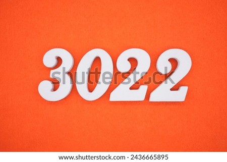 Orange felt is the background. The numbers 3022 are made from white painted wood.