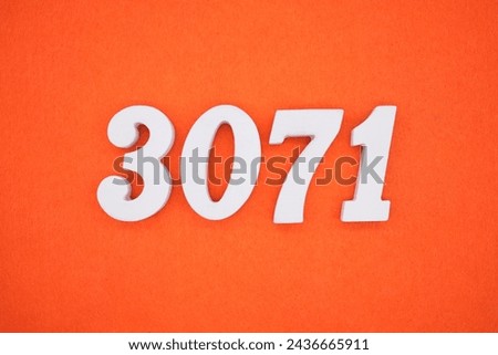 Orange felt is the background. The numbers 3071 are made from white painted wood.
