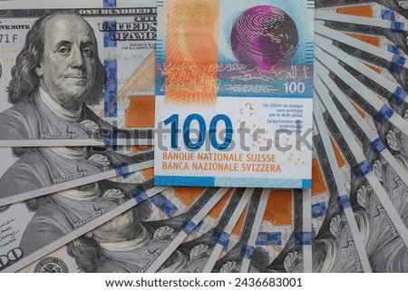 Closeup of 100  Swiss franc and 100 dollar banknotes for design purpose