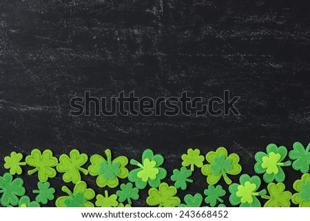 Green Clover on Chalkboard Background Background for St. Patrick's Day Holiday