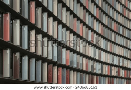Colourful panels on the exterior on Modern architecture of Mizuho bank office building (2 New Ludgate) in city of london. Abstract multi coloured modern architecture, Block windows, Space for text. Royalty-Free Stock Photo #2436685161
