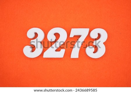 Orange felt is the background. The numbers 3273 are made from white painted wood.