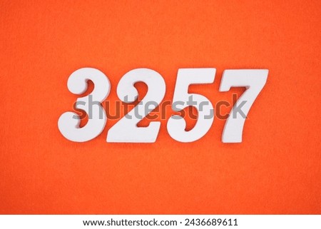 Orange felt is the background. The numbers 3257 are made from white painted wood.