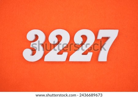 Orange felt is the background. The numbers 3227 are made from white painted wood.