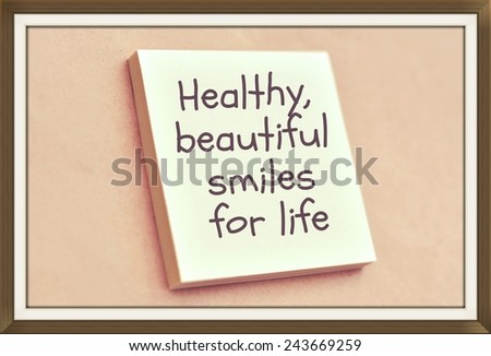 Text healthy beautiful smiles for life on the short note texture background