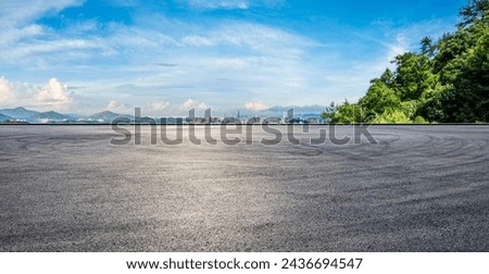 Asphalt road square and green forest with city skyline in Shenzhen. panoramic view.