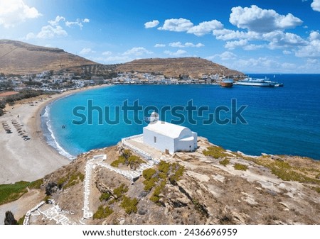 Aerial view of the little chapel of Agios Giorgios in front of the beach and village at Korissia, Kea, Tzia island, Cyclades, Greece Royalty-Free Stock Photo #2436696959