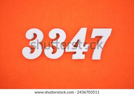 Orange felt is the background. The numbers 3347 are made from white painted wood.