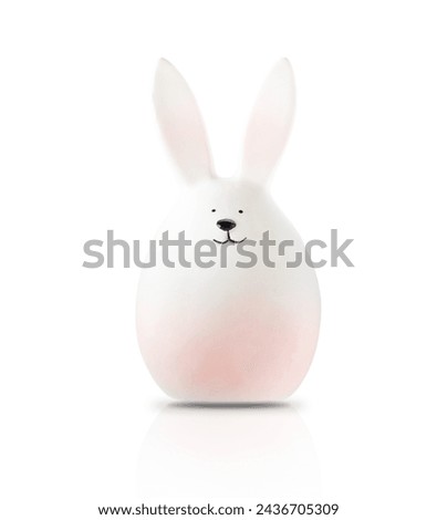 Bunny rabbit toy isolated on white background with clipping path. Ceramic figurine for Easter card design.