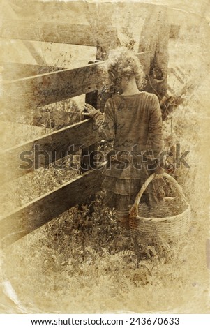 cute little girl playing in the garden. filtered image, old style photo