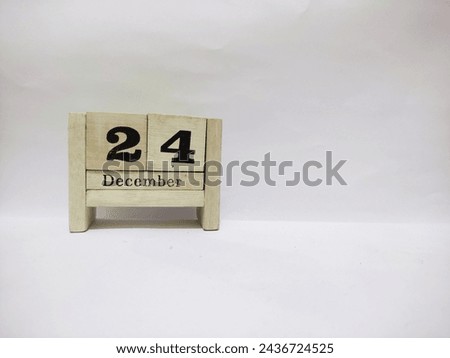 24 december wooden calendar in white background Royalty-Free Stock Photo #2436724525