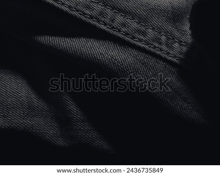 Dark jeans texture at night for a super cool fashion background.  Royalty-Free Stock Photo #2436735849