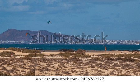 Photography of the beaches of the Corralejo Dunes Natural Park in Fuerteventura with Lanzarote Island on the horizon.